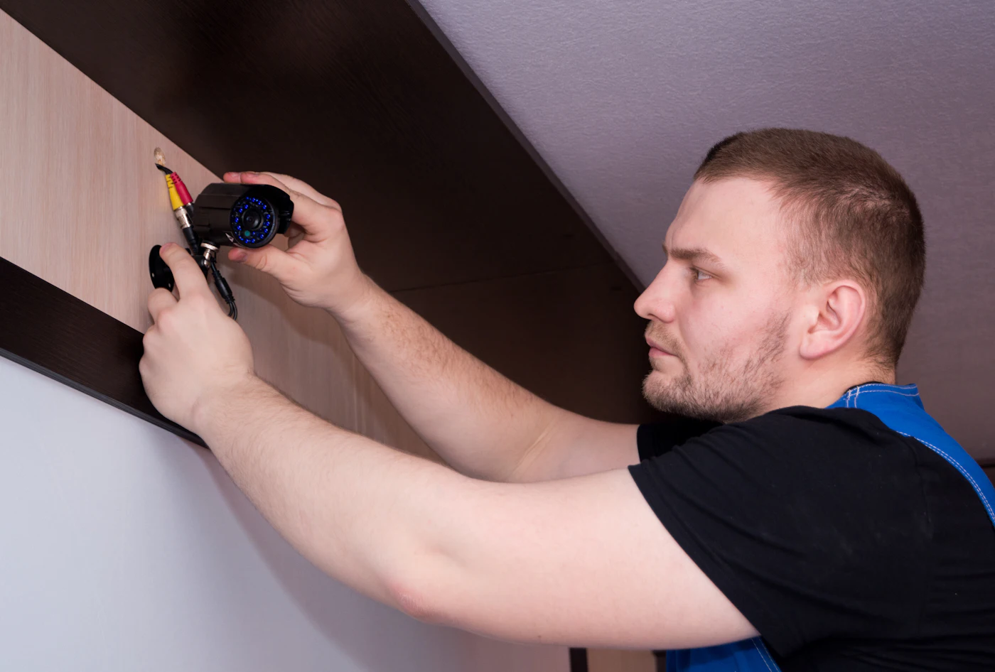 Baytak technician servicing a ceiling device